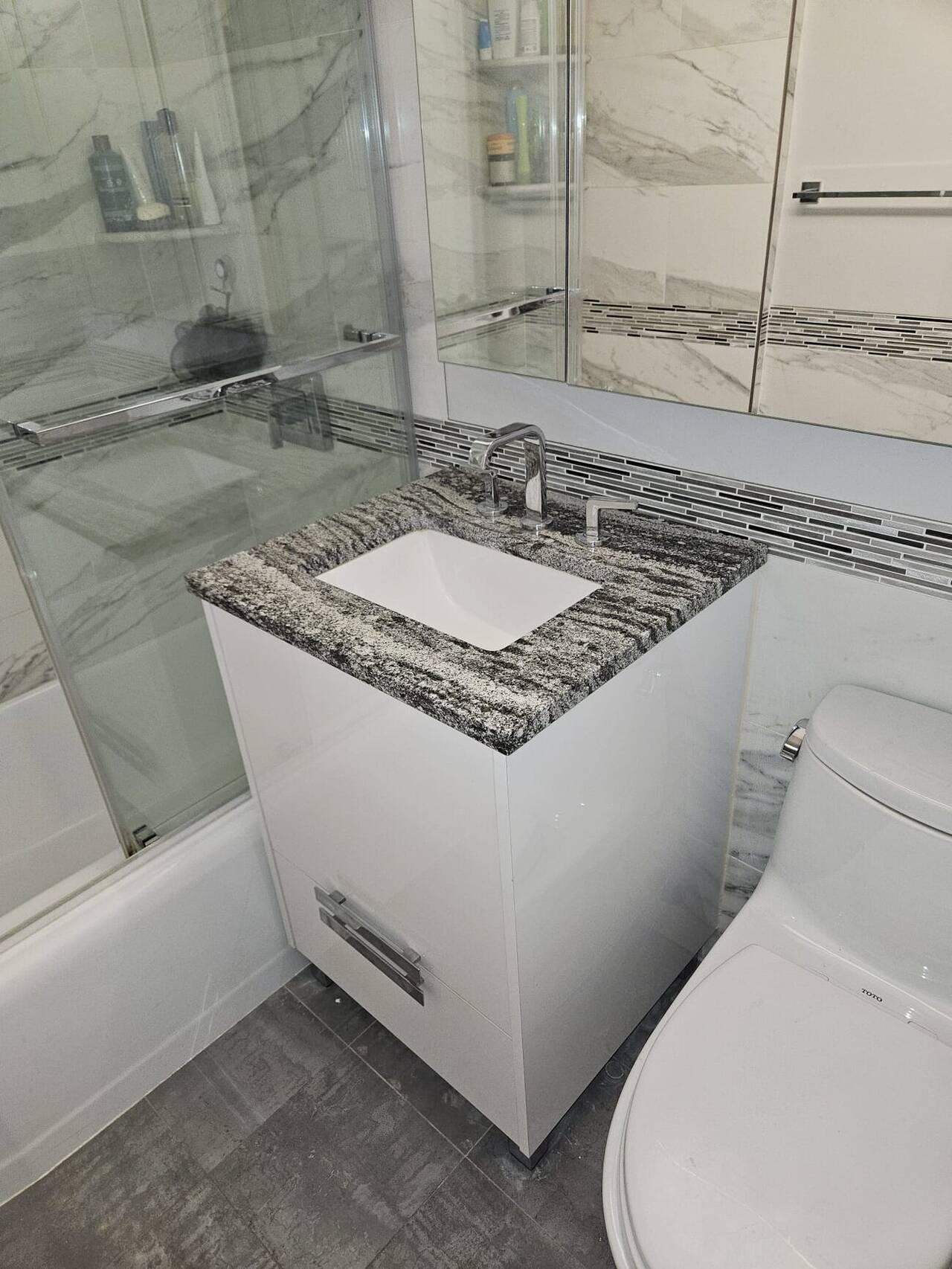 Marble tile bathroom remodel in a Manhattan apartment