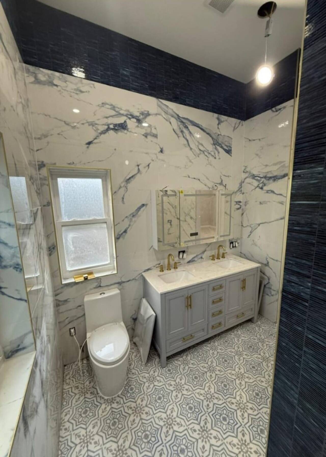 Luxury marble bathroom remodel with patterned tile floor, Manhattan